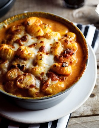 Baked gnocchi with bacon, tomato and mozzarella